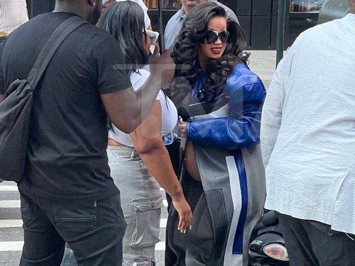 Bloods Cardi B Covered Up by Team Walking Through NYC